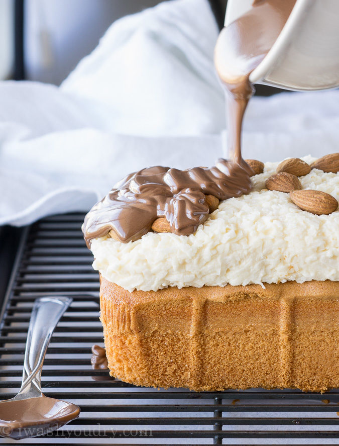 This Super Easy Almond Joy Pound Cake is almost too easy to make. I love how the almonds are put on! haha