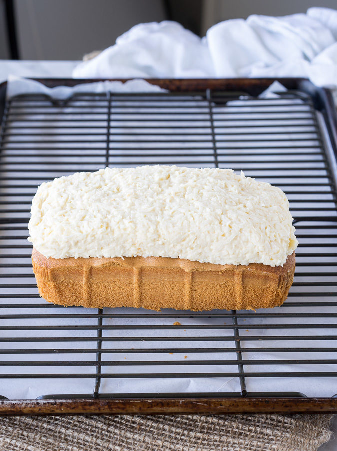 This Super Easy Almond Joy Pound Cake is almost too easy to make. I love how the almonds are put on! haha