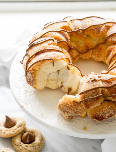 All the goodness of the classic peanut butter blossom, wrapped up in a warm and delicious monkey bread! My family loves this fun dessert recipe, but sometimes we even eat this for breakfast!