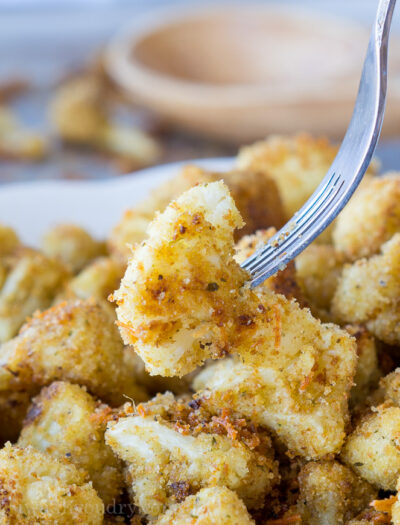 These Parmesan Roasted Cauliflower Bites are so easy to make and taste absolutely phenomenal. My whole family devoured the pan.