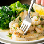 This quick and easy Skillet Tilapia with Shrimp is made in just one skillet and have an outrageously good white wine lemon pan sauce! My whole family loved this!