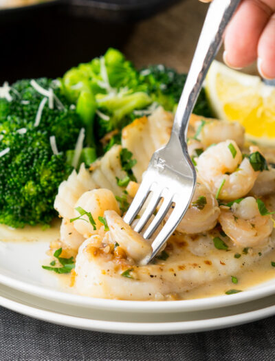 This quick and easy Skillet Tilapia with Shrimp is made in just one skillet and have an outrageously good white wine lemon pan sauce! My whole family loved this!