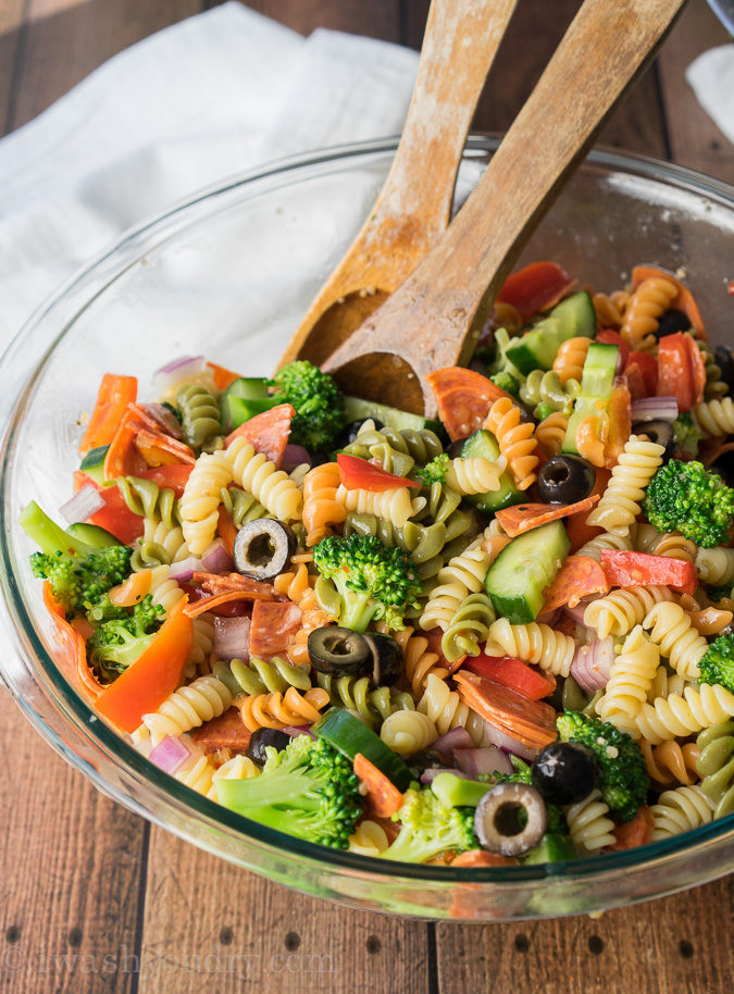 This Classic Italian Pasta Salad is so easy to make, but ALWAYS a favorite whenever I bring it to parties. Everyone always asks for the recipe and there is never any leftovers!