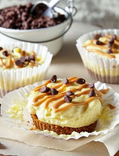 These Mini No Bake Chocolate Peanut Butter Cheesecakes have a Reese's Puffs cereal crust with a creamy vanilla bean cheesecake and a swirl of peanut butter on top. So easy and totally delicious!