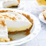 This Biscoff Banana Cream Pie has a biscoff cookie crust and is filled with a creamy banana pudding. It's a no bake pie that's perfect for summer!