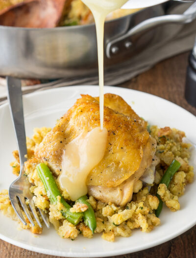 My family loves this Chicken and Stuffing Skillet! It's all made in one pan and it's a complete meal with veggies and a side of stuffing!