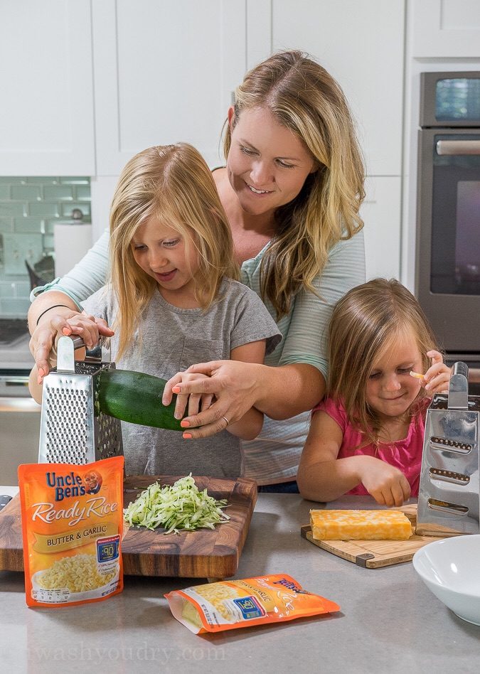 I love making this 5 minute Cheesy Zucchini Rice recipe for a quick and easy side dish! Even my kids get in there and help too!