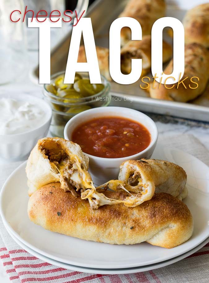 These super simple Cheesy Taco Sticks are buttery breadsticks filled with taco meat and lots of cheese! Perfect for snacking or watching the big game!