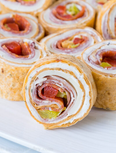 These super flavorful Italian Pinwheels are a fantastic appetizer or perfect for school lunches!