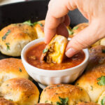 This Cheesy Taco Bombs Skillet is a quick and easy appetizer recipe that's filled with tender taco meat and gooey cheese!