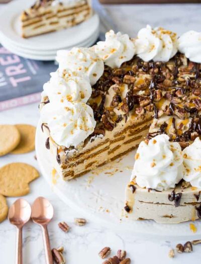 This no bake Gingersnap Turtle Icebox Cake is loaded with a sweet and creamy molasses filling, crisp gingersnap cookies and a hot fudge and caramel topping that's to die for!