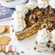 This no bake Gingersnap Turtle Icebox Cake is loaded with a sweet and creamy molasses filling, crisp gingersnap cookies and a hot fudge and caramel topping that's to die for!