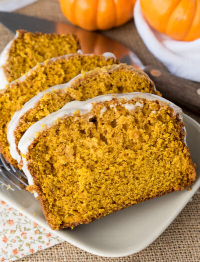 This super moist Pumpkin Bread with Maple Icing is bursting with fall flavors and perfect for a sweet breakfast, brunch or dessert!