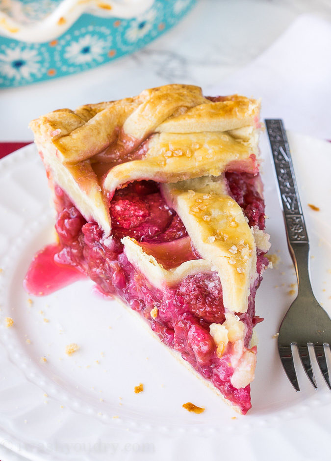 This homemade Raspberry Pie recipe is perfection! The filling is sweet and stays together, doesn't fall apart!