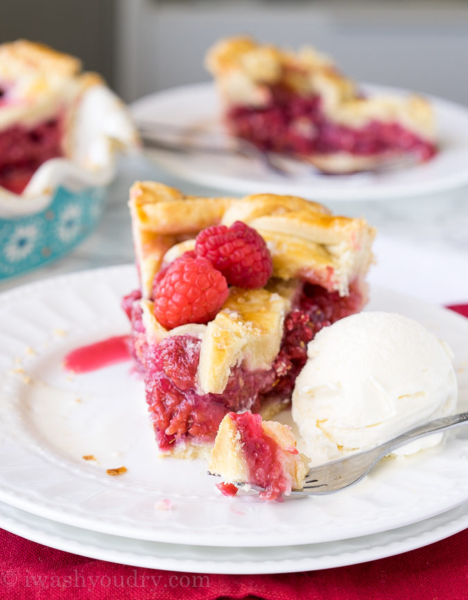 This homemade Raspberry Pie recipe is perfection! The filling is sweet and stays together, doesn't fall apart!