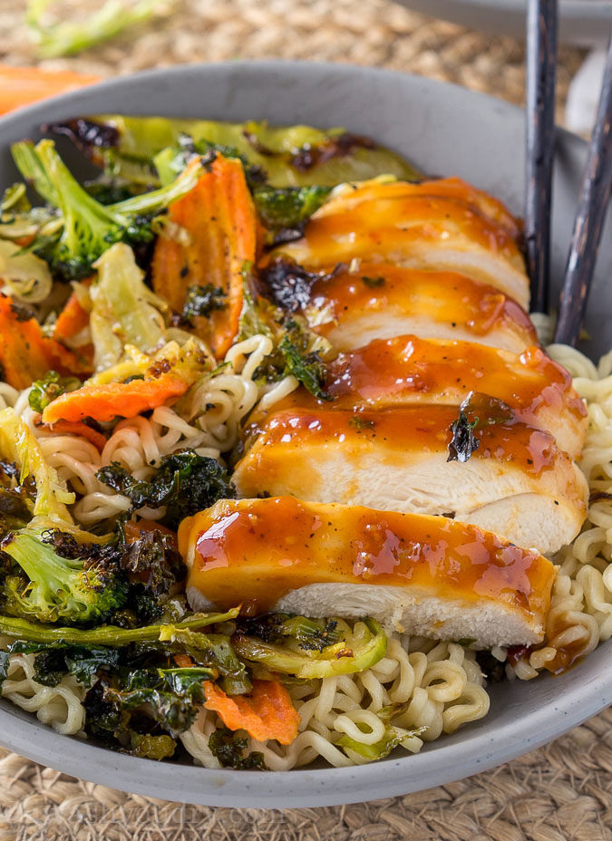 These super quick Roasted Orange Chicken Ramen Bowls are ready in less than 30 minutes! Filled with loads of veggies, plump and tender chicken all over a bed of hot noodles and drizzled with a tasty orange sauce! 