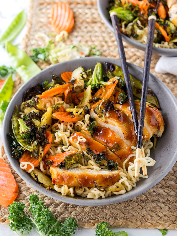 These super quick Roasted Orange Chicken Ramen Bowls are ready in less than 30 minutes! Filled with loads of veggies, plump and tender chicken all over a bed of hot noodles and drizzled with a tasty orange sauce! 