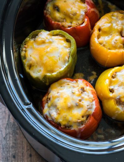 These Slow Cooker Steakhouse Stuffed Peppers are bursting with flavor and only take a few minutes to prep! The perfect easy weeknight dinner recipe!