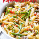 This Creamy Chicken Asparagus Penne Pasta is filled with fresh veggies and tender pasta in a light and creamy sauce! Another easy weeknight dinner recipe!