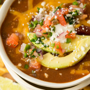 This Quick and Easy Taco Soup recipe is a family favorite! We love topping it with all the taco toppings!