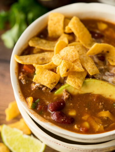 This Quick and Easy Taco Soup recipe is a family favorite! We love topping it with all the taco toppings!