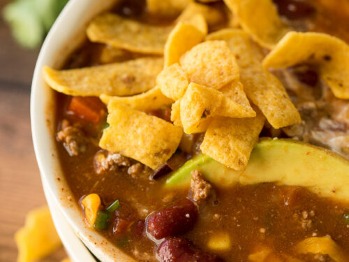 This Quick and Easy Taco Soup recipe is a family favorite! We love topping it with all the taco toppings!