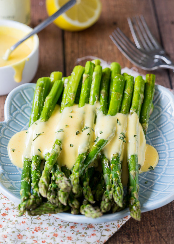 roasted asparagus with hollandaise sauce on top