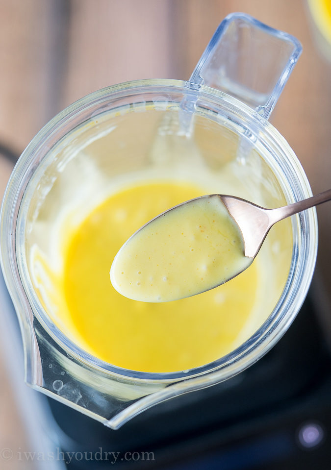 spoon of hollandaise sauce in blender