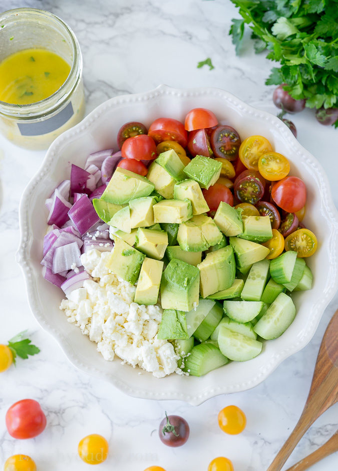 This Cucumber Tomato Avocado Salad is so fresh and delicious! I love the super simple dressing that it's tossed in!