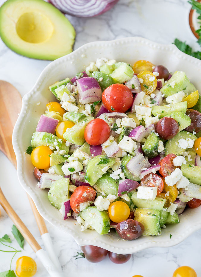 This Cucumber Tomato Avocado Salad is so fresh and delicious! I love the super simple dressing that it's tossed in!