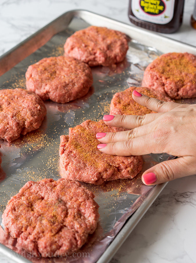 These Honey BBQ Cowboy Burgers are thick and juicy hamburger patties that are topped with cheese, Sweet Baby Ray's Honey BBQ Sauce and crispy onion rings. It's a party in your mouth!