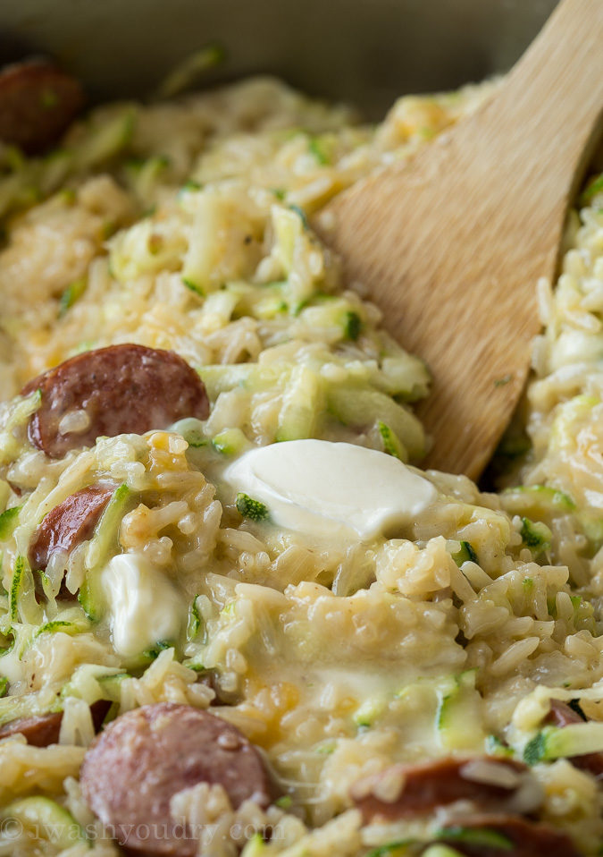 This Cheesy Sausage Zucchini Rice Skillet is a super quick dinner that's filled with everything my family loves, plus I get to sneak in some veggies!