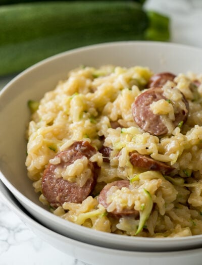 This Cheesy Sausage Zucchini Rice Skillet is a super quick dinner that's filled with everything my family loves, plus I get to sneak in some veggies!