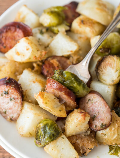 This Parmesan Roasted Sheet Pan Dinner is a complete meal all made on one pan! My kids go crazy for this simple dinner recipe!