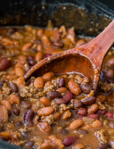 These Slow Cooker Steakhouse Cowboy Baked Beans are a thick and hearty side dish with a punch of savory and sweet spices!