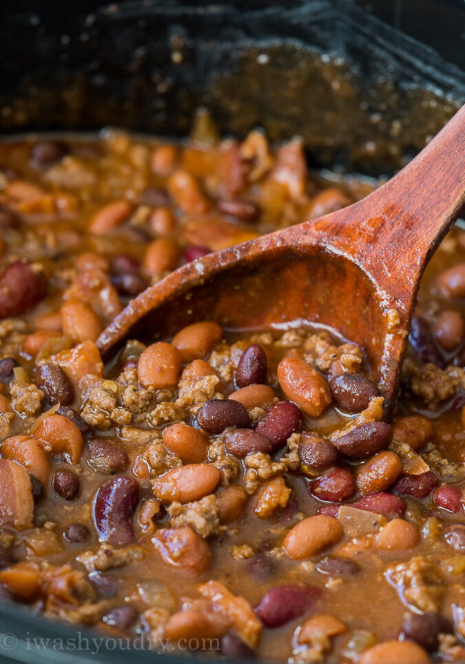 These Slow Cooker Steakhouse Cowboy Baked Beans are a thick and hearty side dish with a punch of savory and sweet spices!