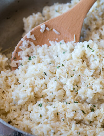 My kids LOVED this creamy Garlic Parmesan Rice side dish recipe! So quick and easy to make!