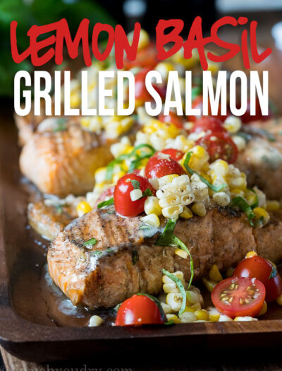 This Lemon Basil Grilled Salmon is topped with a lemon and basil infused butter and a grilled corn and tomato salad that's so fresh and delicious!