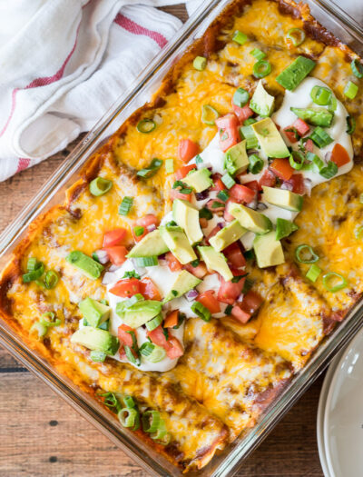 Once your beef enchiladas are done, top with all your favorite taco toppings and enjoy!