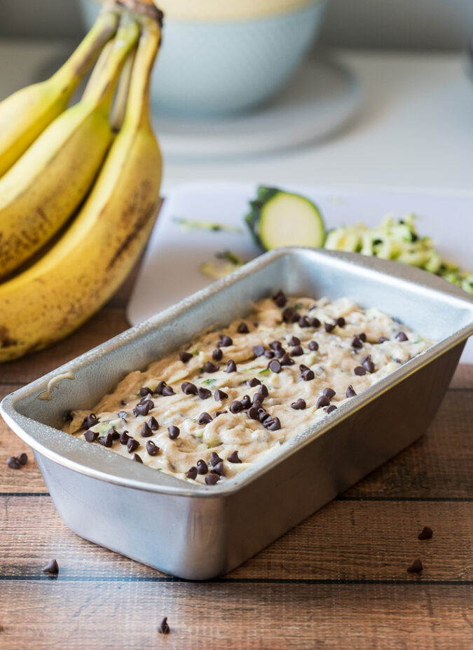 Pour your zucchini bread batter into a prepared loaf pan and bake until a toothpick inserted in the center comes out clean.