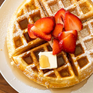 A plate of food, with Waffle