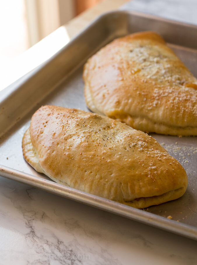 These cheesy BBQ Pork Calzones are a super easy weeknight dinner recipe that comes together in just a few minutes! 