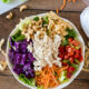 By placing the colorful ingredients around the bowl it makes it more attractive and fun to eat! Your kids will LOVE this Asian Chicken Salad!