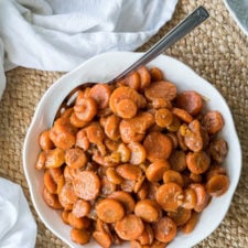 A bowl of food with glazed carrots