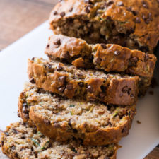 A piece of cake on a plate, with zucchini Bread