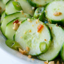 A close up of a bowl of cucumber salad