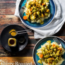 Two plates of food with Brussel sprouts, chicken and other befits on rice