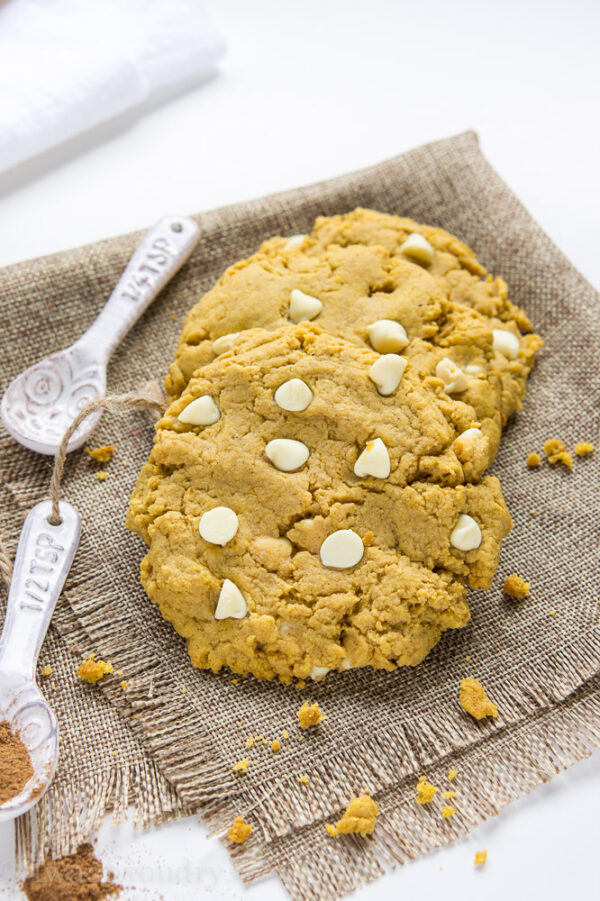 Pumpkin Cheesecake Pudding cookies on a plate with white chocolate chips