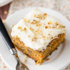 A piece of carrot cake on a plate