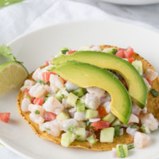 shrimp served with avocado on top